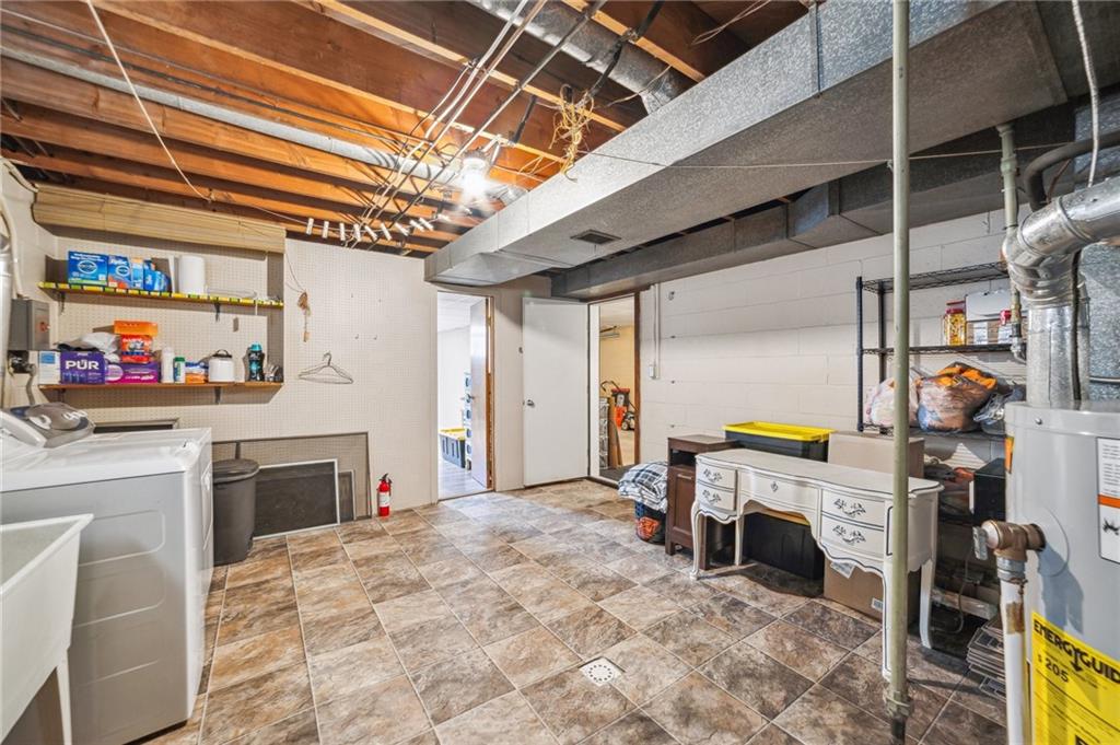 11401 McKee Road Irwin, PA 15642 - Photo 19 of 27 a view of a hallway with washer and dryer