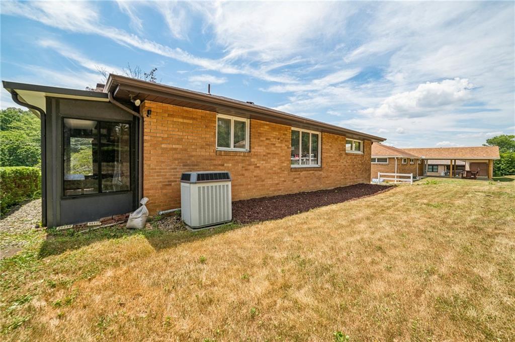 11401 McKee Road Irwin, PA 15642 - Photo 21 of 27 a front view of a house with a yard