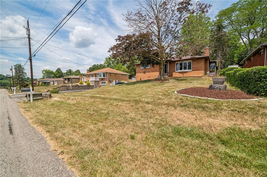 11401 McKee Road Irwin, PA 15642 - Photo 25 of 27 a front view of a house with a yard