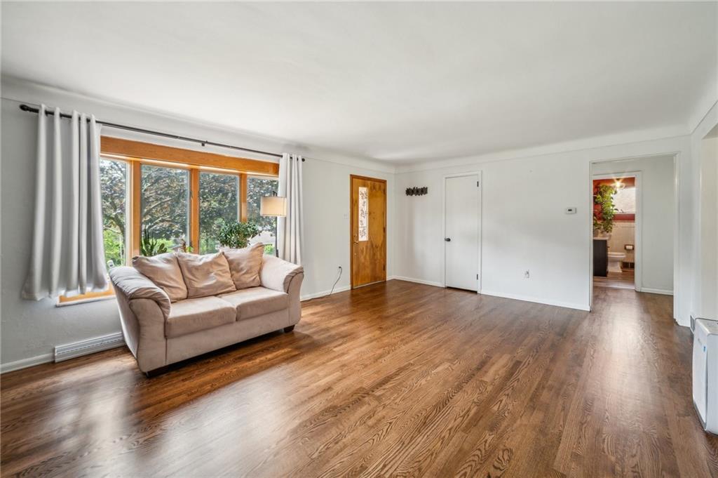 11401 McKee Road Irwin, PA 15642 - Photo 5 of 27 a living room with furniture and a large window