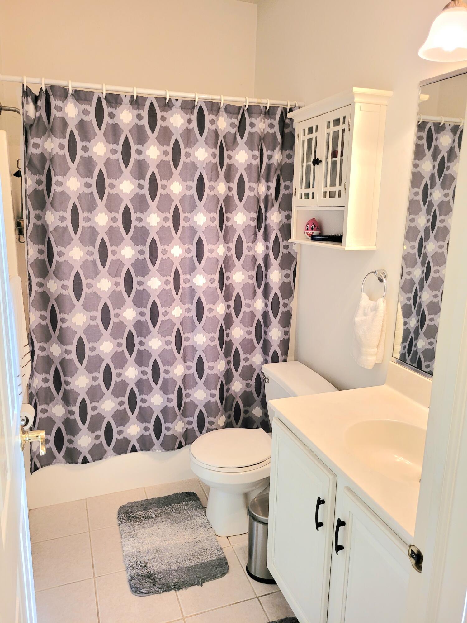 5480 Victoria Place Crown Point, IN 46307 - Photo 14 of 14 a bathroom with a toilet and a shower curtain