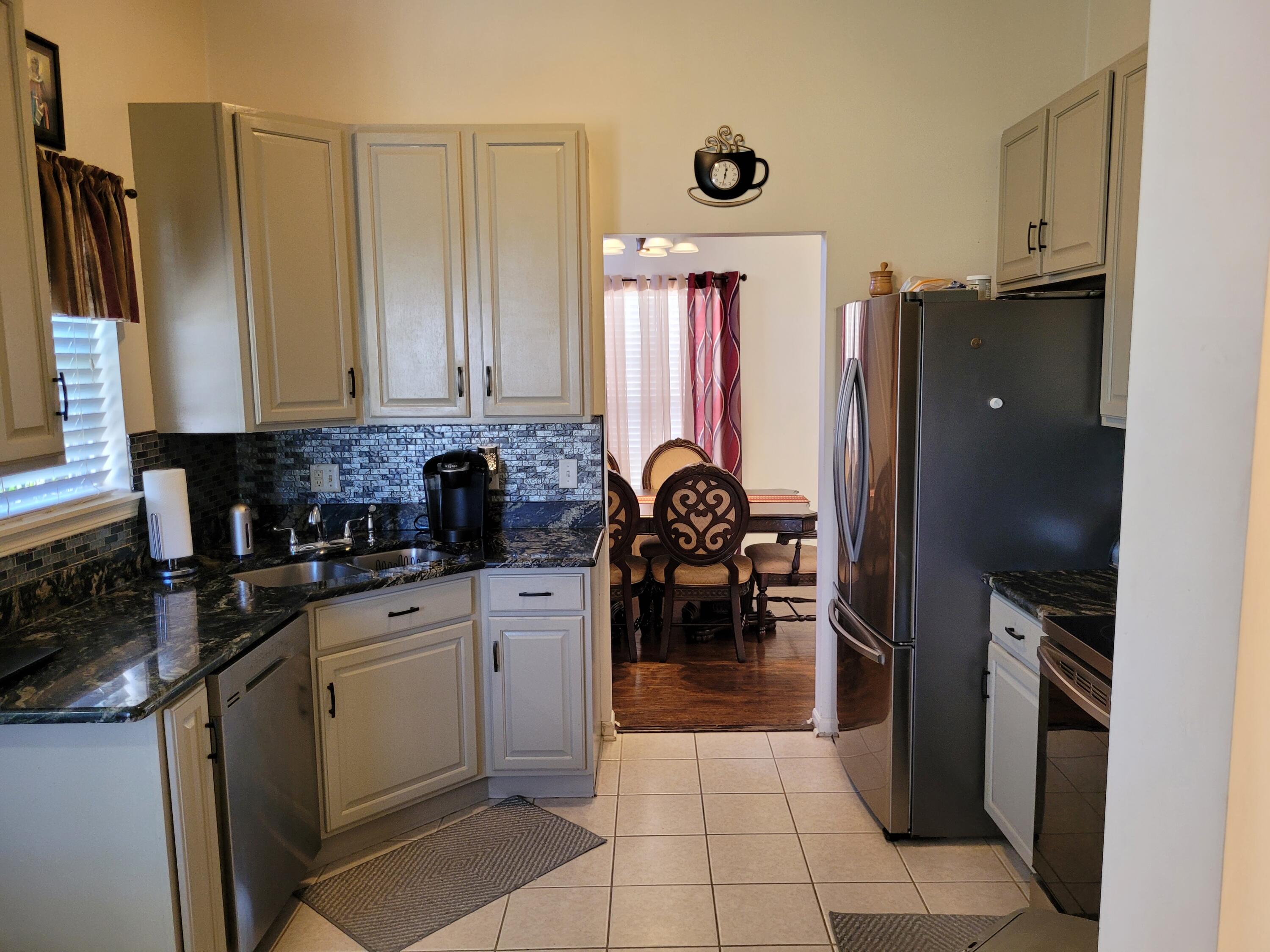 5480 Victoria Place Crown Point, IN 46307 - Photo 5 of 14 a kitchen with stainless steel appliances a refrigerator sink and cabinets