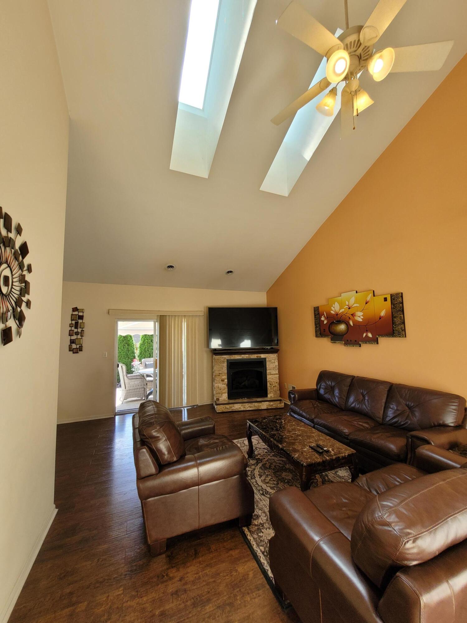 5480 Victoria Place Crown Point, IN 46307 - Photo 7 of 14 a living room with furniture and a fireplace