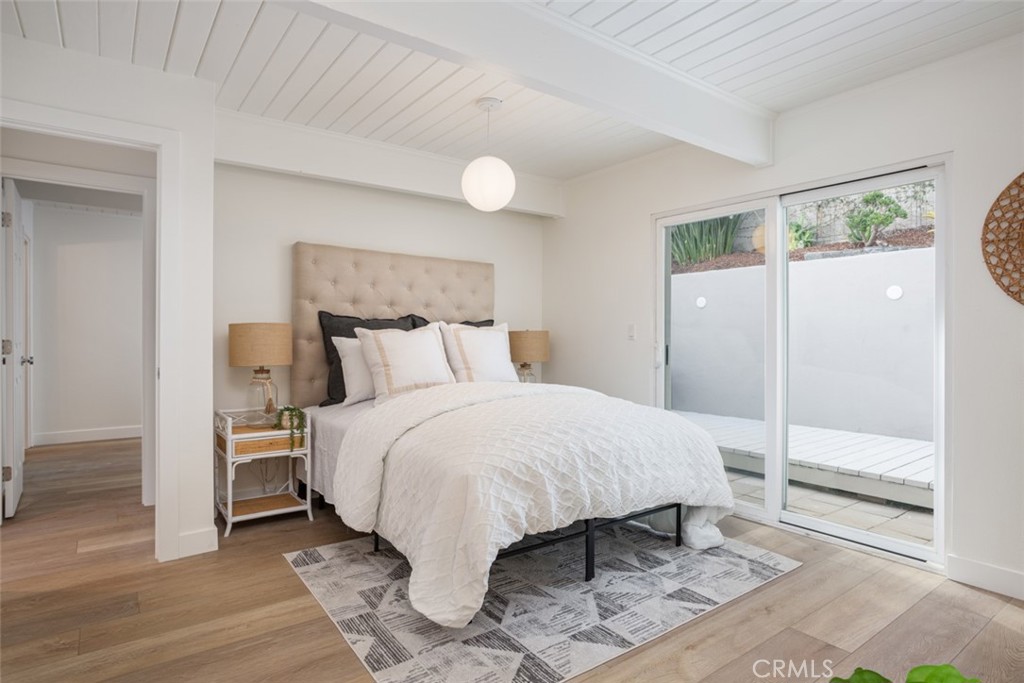 33961 Crystal Lantern Dana Point, CA 92629 - Photo 12 of 28 a bedroom with a bed and a mirror