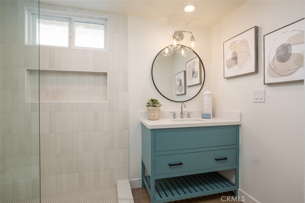 33961 Crystal Lantern Dana Point, CA 92629 - Photo 16 of 28 a bathroom with a sink mirror and vanity