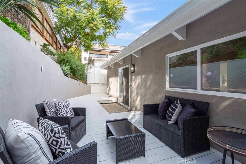 33961 Crystal Lantern Dana Point, CA 92629 - Photo 22 of 28 a outdoor living room with furniture and a large window