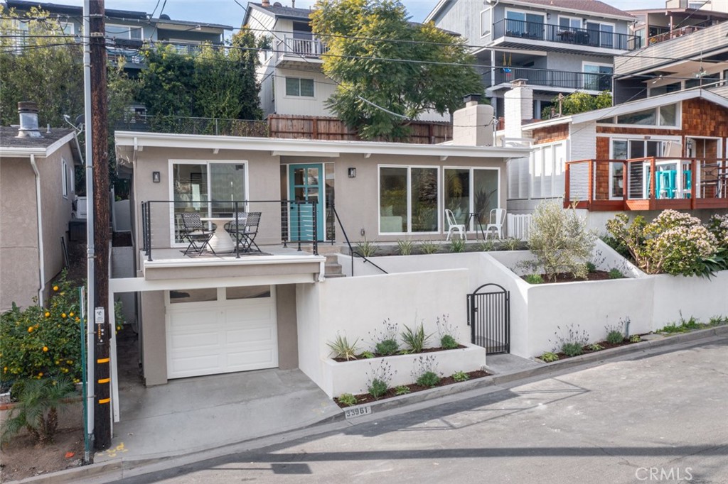 33961 Crystal Lantern Dana Point, CA 92629 - Photo 28 of 28 front view of a building with a yard