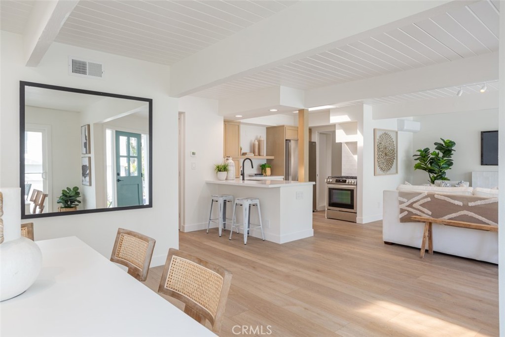 33961 Crystal Lantern Dana Point, CA 92629 - Photo 4 of 28 a living room with furniture and a large mirror next to a window
