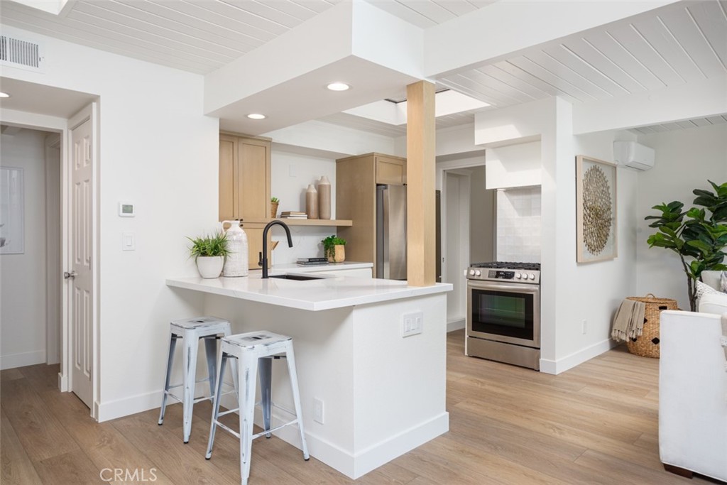33961 Crystal Lantern Dana Point, CA 92629 - Photo 5 of 28 a kitchen with stainless steel appliances a sink stove and refrigerator