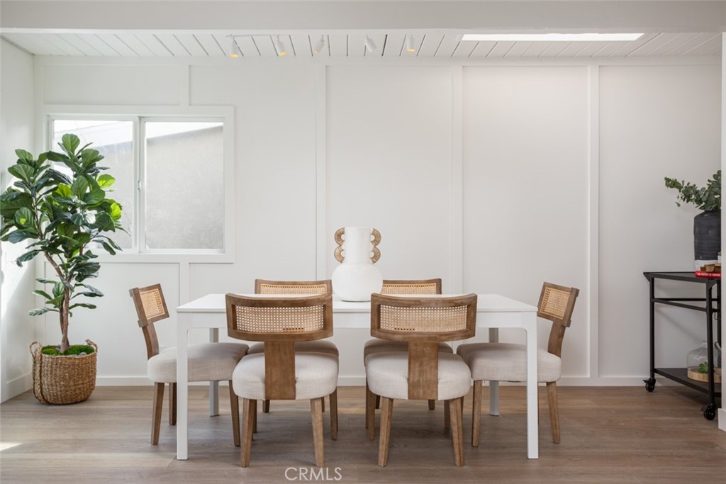 33961 Crystal Lantern Dana Point, CA 92629 - Photo 9 of 28 a dining room with furniture and wooden floor