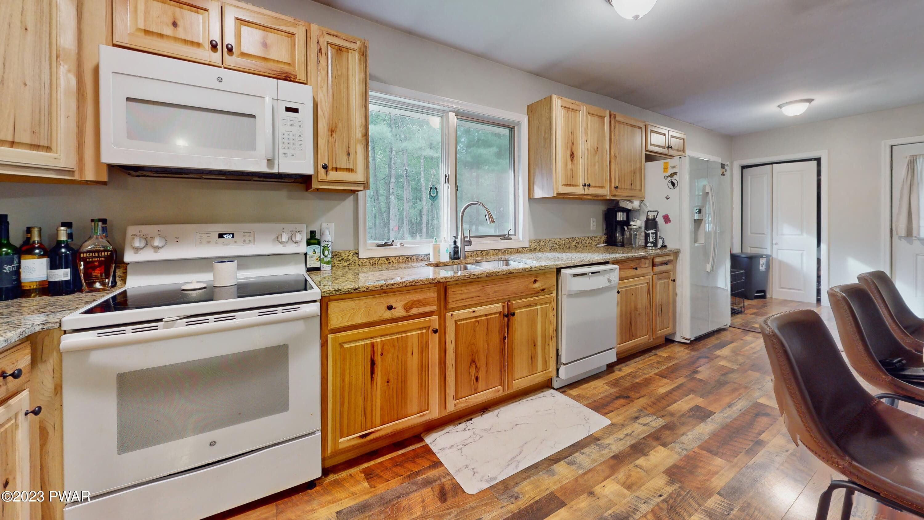 149 Walker Lake Road Shohola, PA 18458 - Photo 25 of 51 a kitchen with cabinets appliances washer and dryer