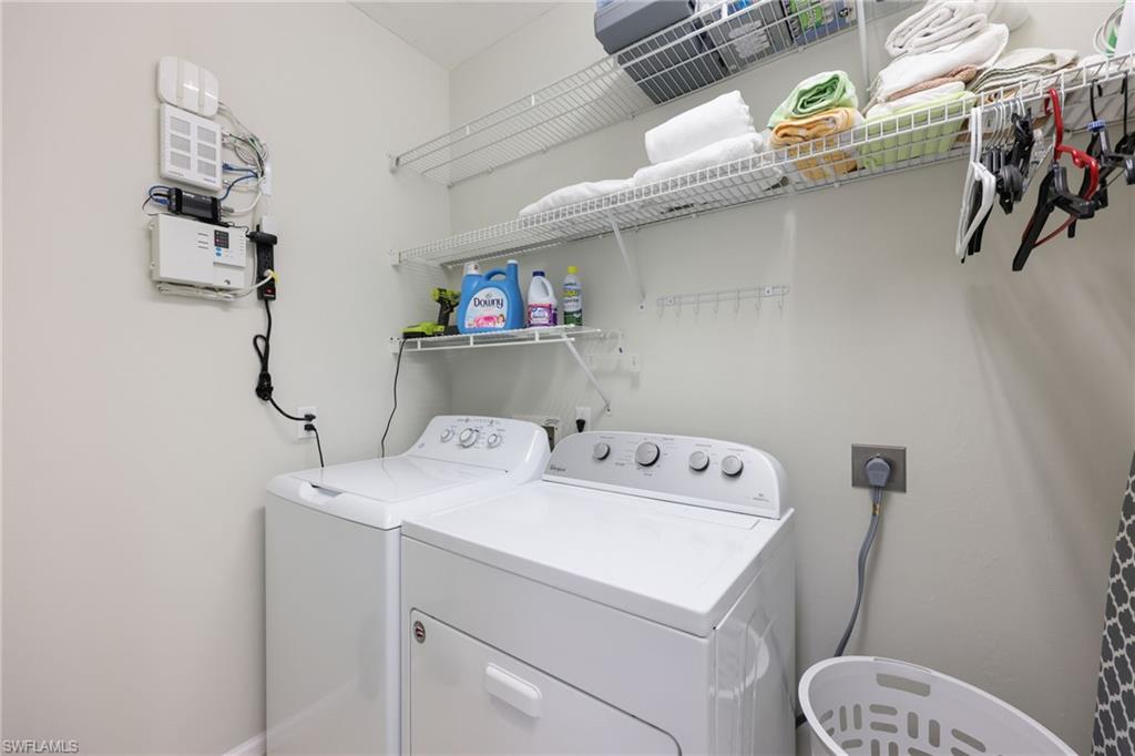 7828 Gardner Drive, Unit 5202 Naples, FL 34109 - Photo 28 of 44 a utility room with dryer and washer