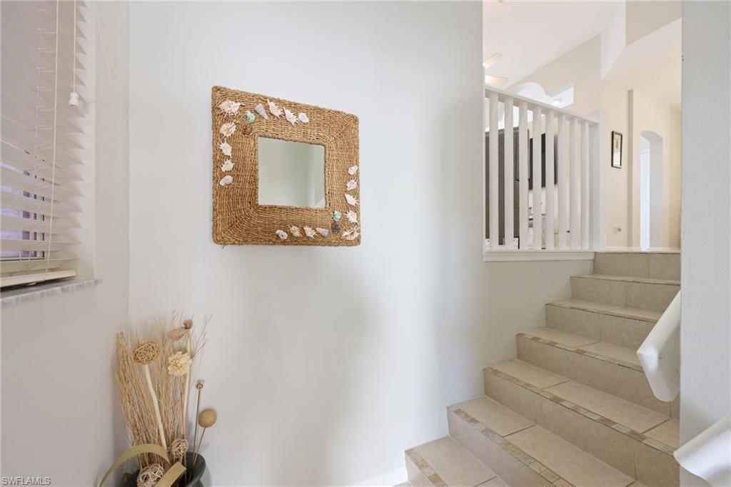 7828 Gardner Drive, Unit 5202 Naples, FL 34109 - Photo 29 of 44 a view of staircase with white walls