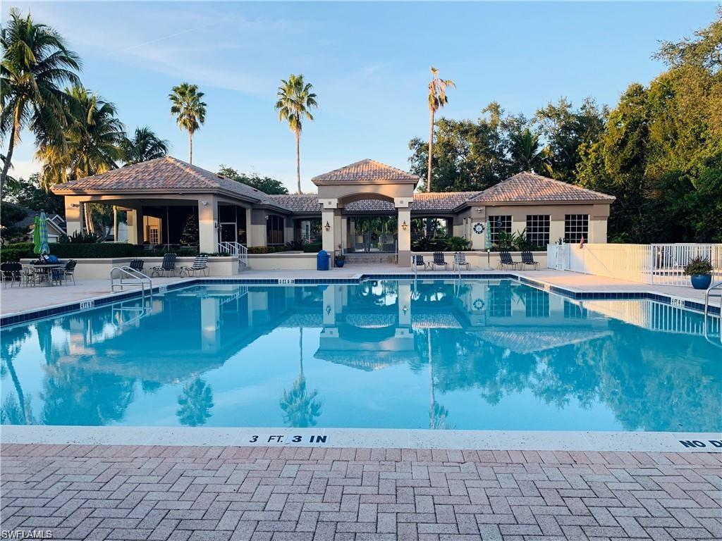 7828 Gardner Drive, Unit 5202 Naples, FL 34109 - Photo 34 of 44 a view of a house with a yard
