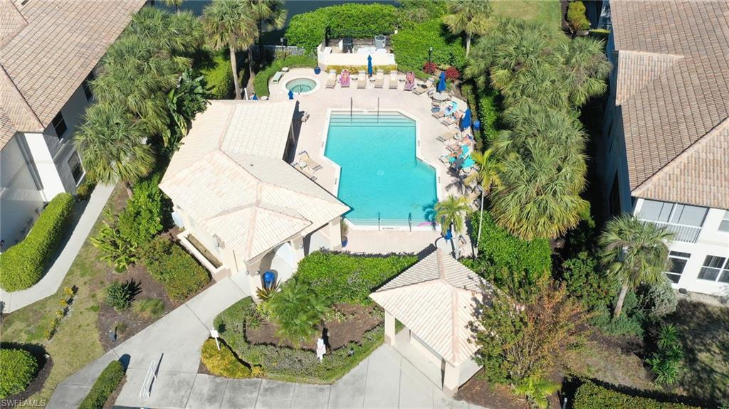 7828 Gardner Drive, Unit 5202 Naples, FL 34109 - Photo 36 of 44 an aerial view of a house with a yard and trees