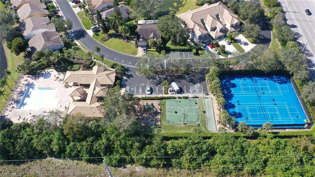 7828 Gardner Drive, Unit 5202 Naples, FL 34109 - Photo 40 of 44 an aerial view of a house with a swimming pool