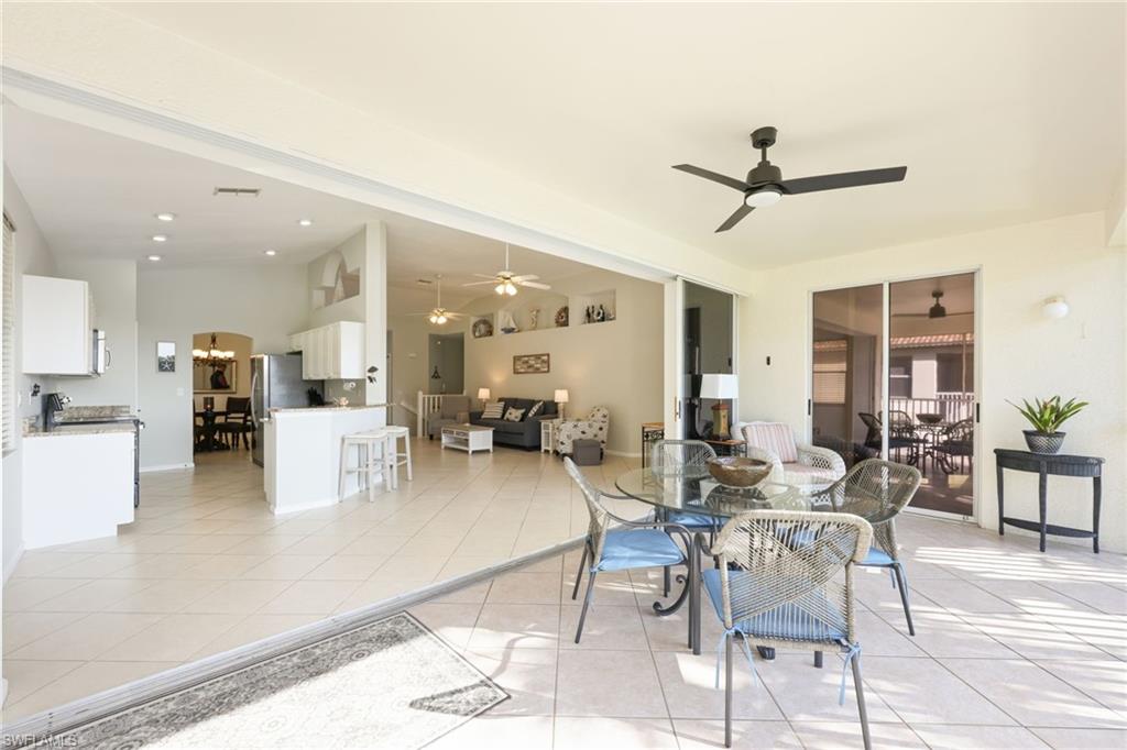7828 Gardner Drive, Unit 5202 Naples, FL 34109 - Photo 8 of 44 a view of a dining room with furniture