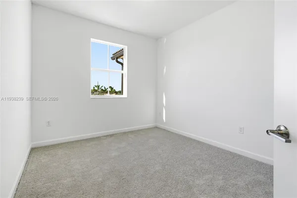 a kitchen with white cabinets and a sink