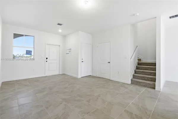 an empty room with a natural light