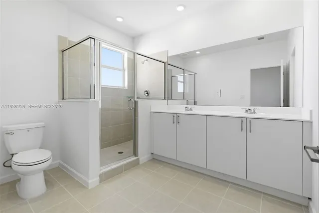 a bathroom with a double vanity sink and mirror