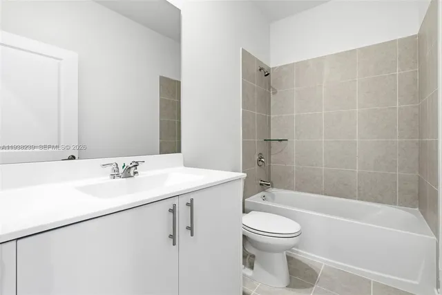 a bathroom with a toilet a sink and a bathtub