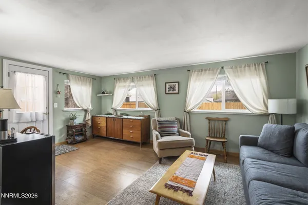 a living room with furniture and a window