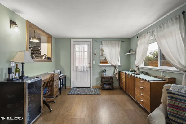 a view of a kitchen with dining table and chairs