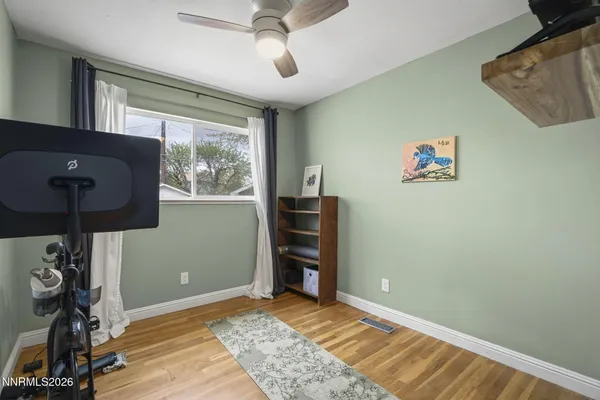 a view of room with window and ceiling fan