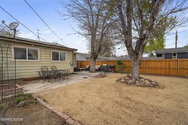 a view of a house with snow on the road