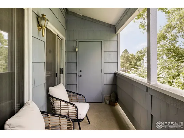 a bedroom with a bed and large window
