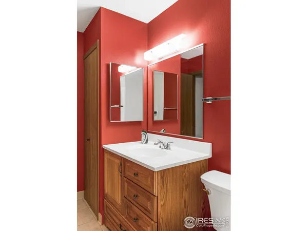 a balcony view with a glass door and shower