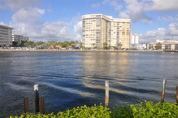 a view of a lake with tall buildings