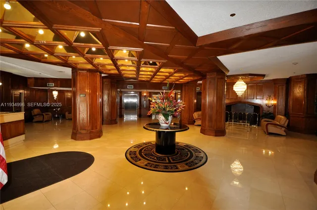 a room with lots of chairs and a chandelier