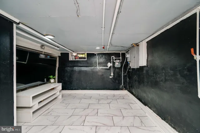 a hallway with a view of living room