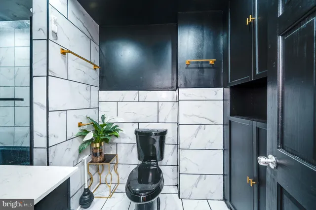 a kitchen with a sink and a potted plant