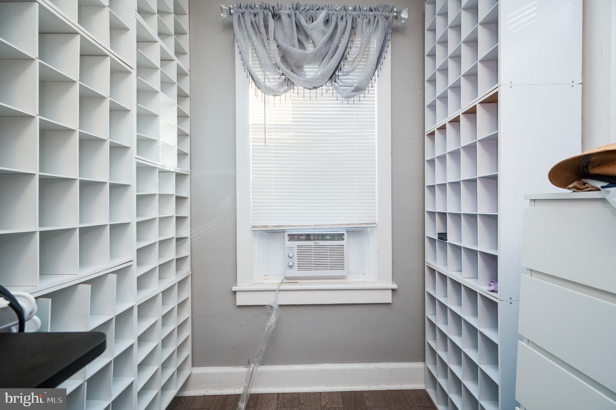 816 Franklin Street Reading, PA 19602 - Photo 10 of 20 a view of a livingroom with a bookshelf and a window