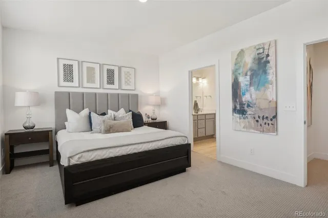a spacious bedroom with a bed and cabinets