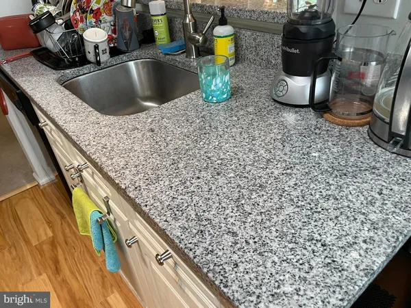 a kitchen with a sink and a stove