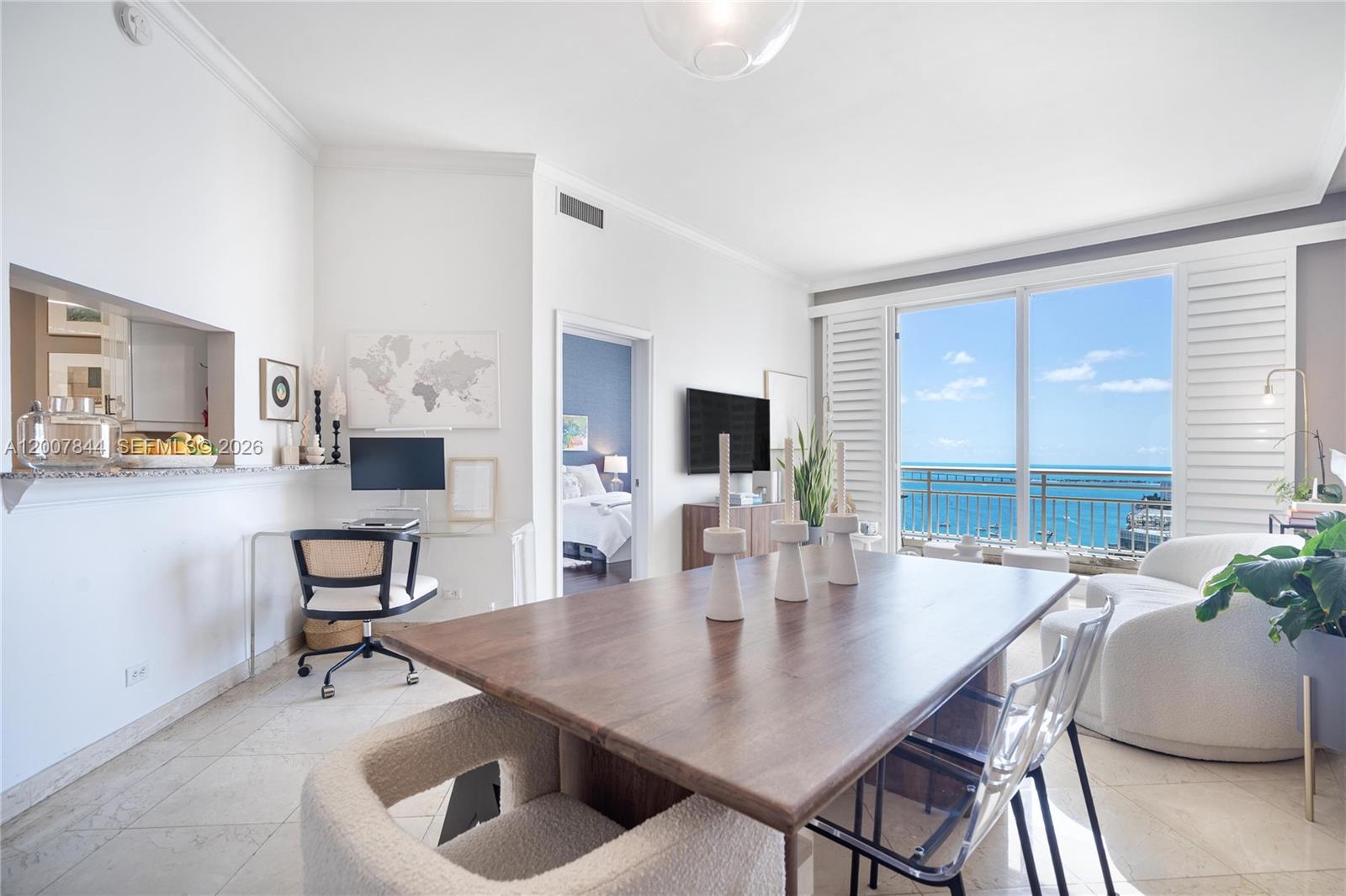 888 Brickell Key Drive, Unit 2602 Miami, FL 33131 - Photo 12 of 29 a view of a dining room with furniture and window