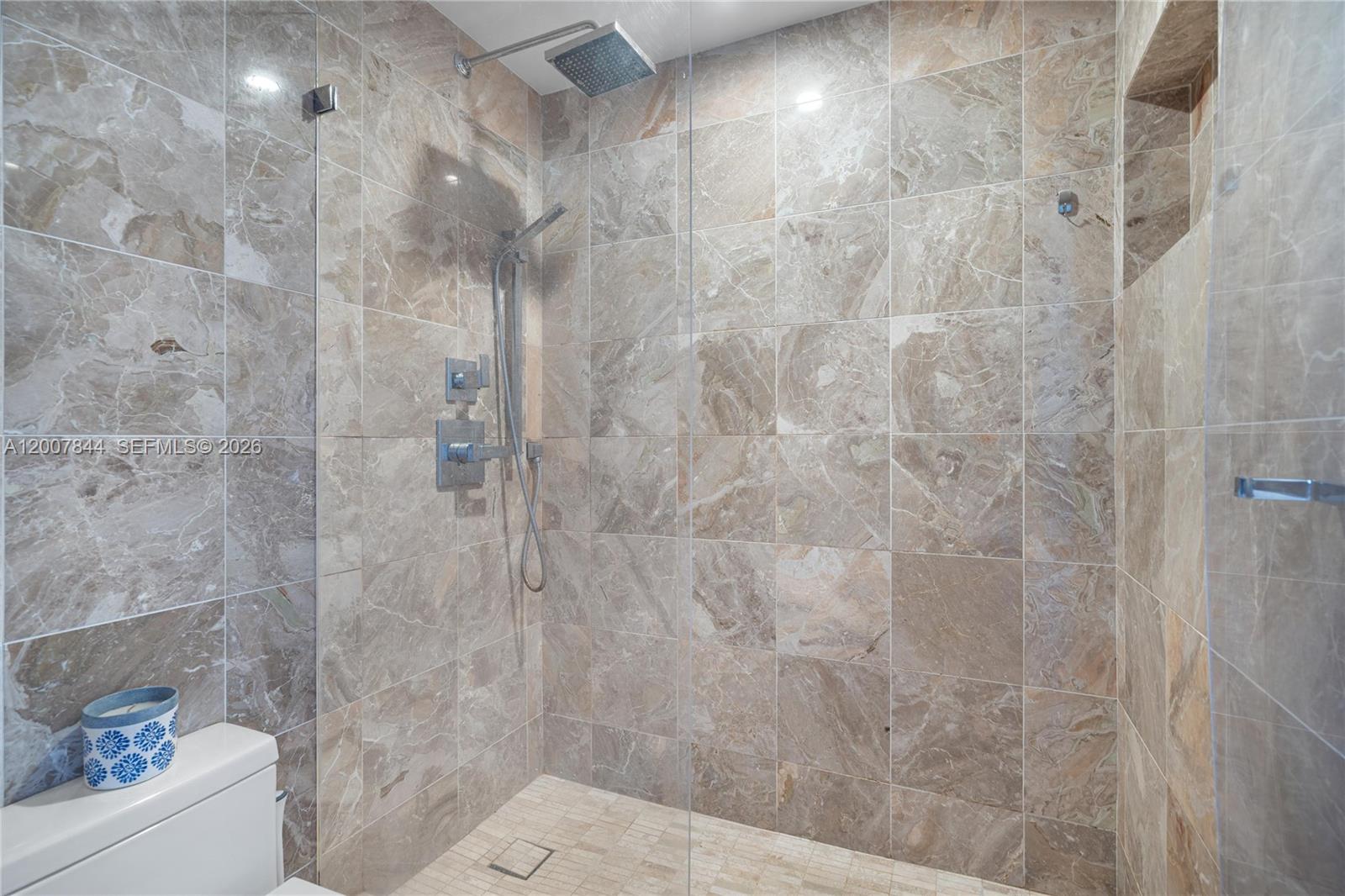 888 Brickell Key Drive, Unit 2602 Miami, FL 33131 - Photo 24 of 29 a bathroom with a shower