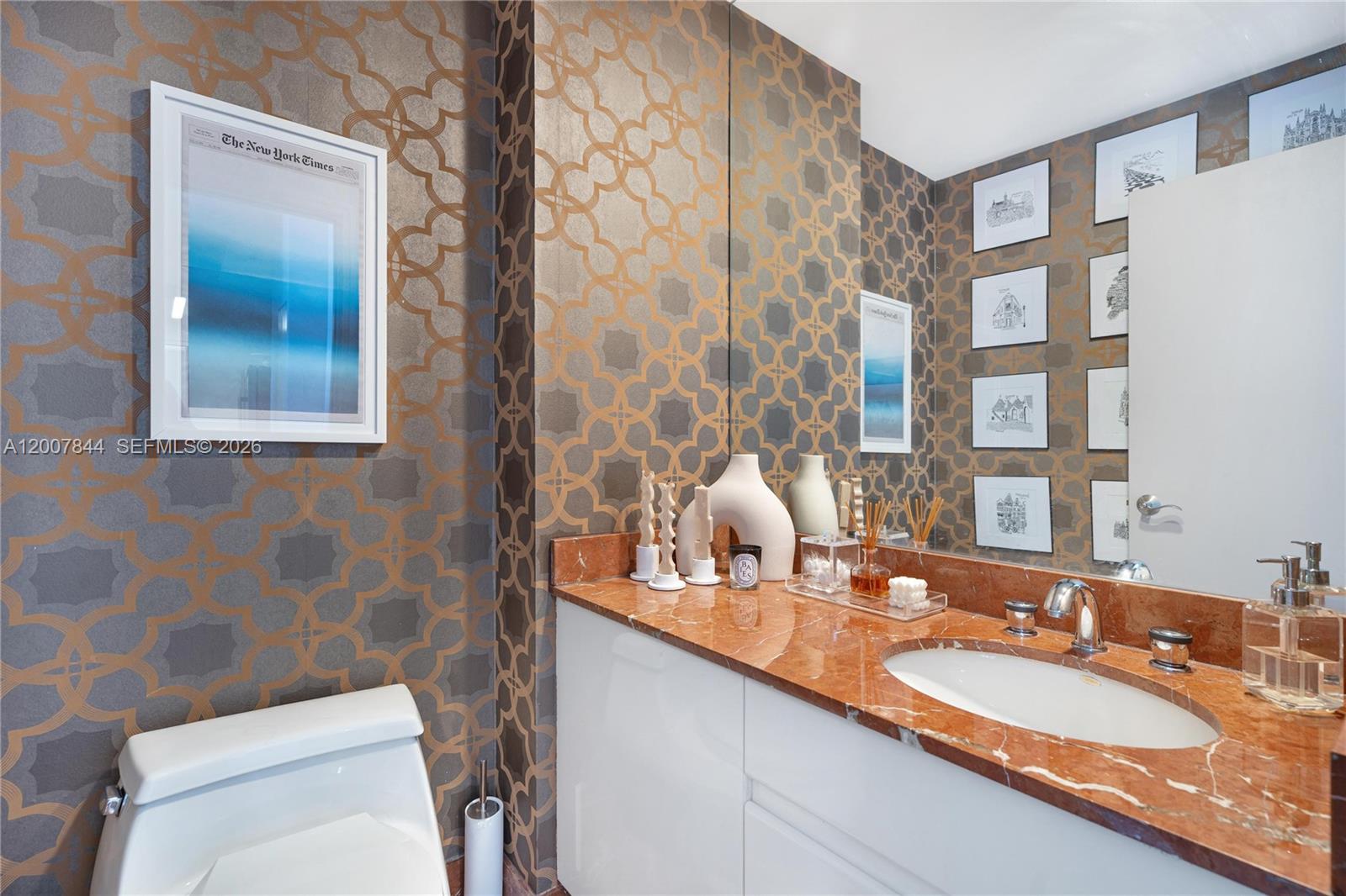 888 Brickell Key Drive, Unit 2602 Miami, FL 33131 - Photo 25 of 29 a bathroom with a granite countertop sink and a mirror