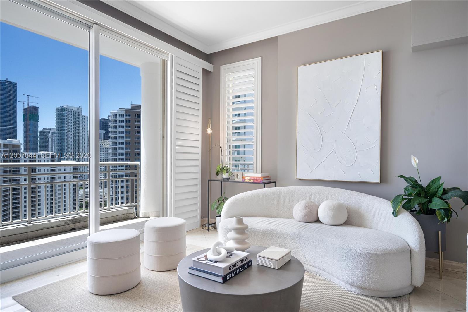 888 Brickell Key Drive, Unit 2602 Miami, FL 33131 - Photo 6 of 29 a living room with furniture and a potted plant