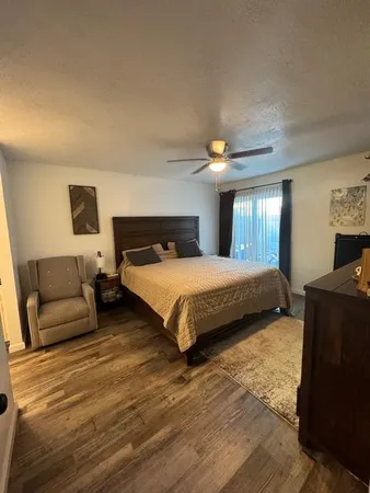 a bedroom with a bed and a couch