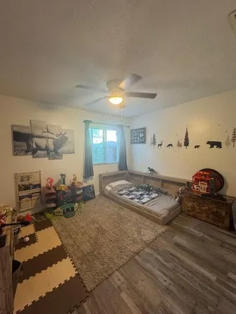 a bedroom with furniture and a window