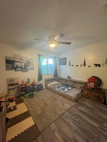 a bedroom with furniture and a window