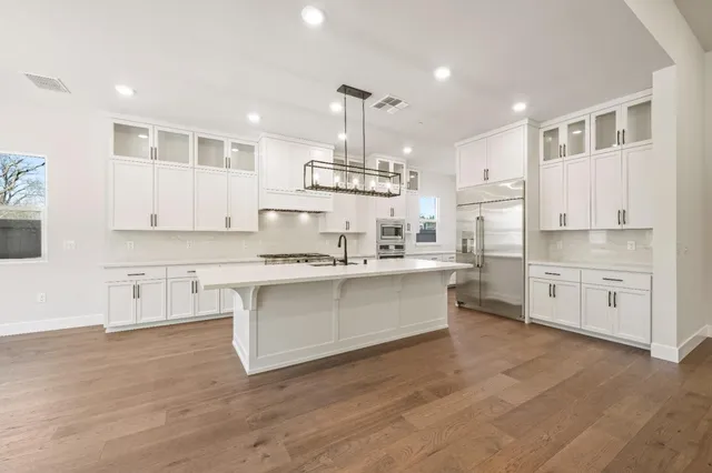 a living room with a fireplace and a table