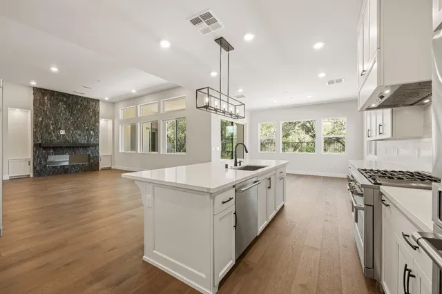 an empty room with large windows and mountain view