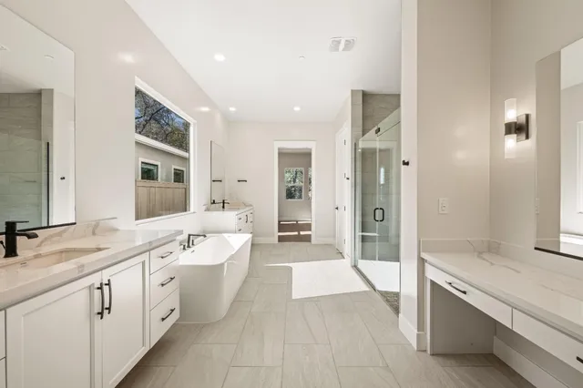 a bathroom with a bathtub and a sink