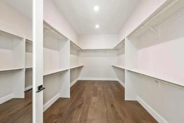 a bathroom with a shower and a room