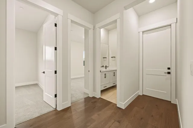 a bathroom with a sink and a mirror with toilet
